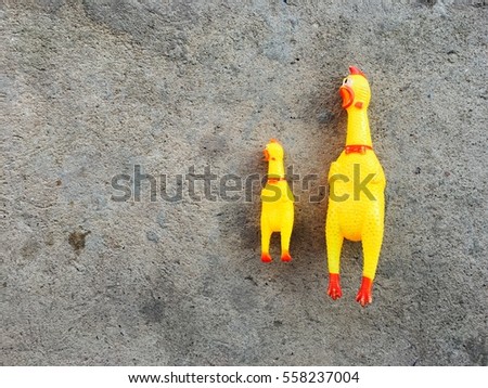 Chicken toy for dog on concrete floor