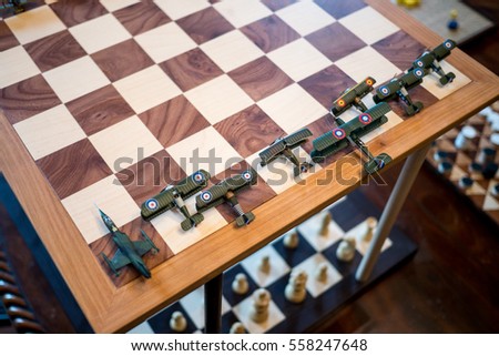 Strange double chessboard with aircraft models