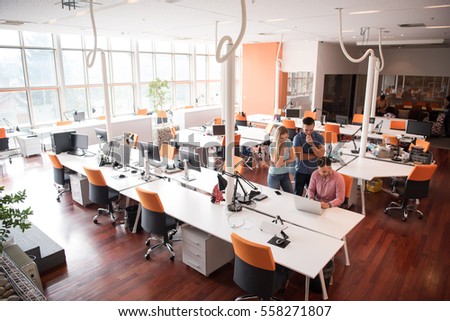 Group of young people employee workers with computer in urban alternative studio - Business concept of human resource and fun on working time - Start up entrepreneurs at office - Bright vintage filter Royalty-Free Stock Photo #558271807