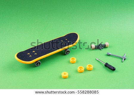 Mini Skate Board Toy in Green background.