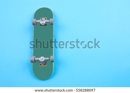 Mini Skate Board Toy in Blue background.