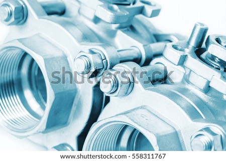 Detail of group 2 valves located on the diagonal, ball valve with selective focus on thread fittings. Technical blue colored.