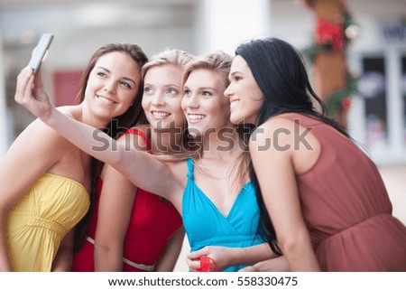 Women taking picture together outdoors
