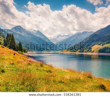 Colorful summer morning on the Speicher Durlassboden lake. View of Richterspitze mountain range in the Austrian Alps, Schwaz district in Tyrol, Austria, Europe. Artistic style post processed photo.