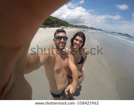 Couple taking a selfie in Brazilian Beach
