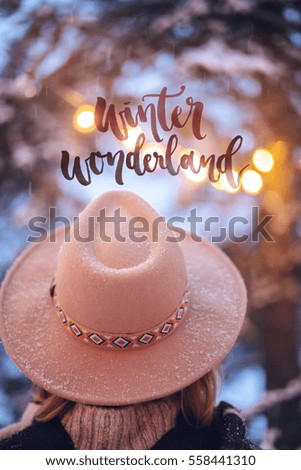Mood Postcard with Hipster Girl wearing in hat, Inspirational greeting card with text "Winter wonderland, Winter mood, Calligraphy lettering.