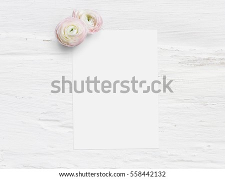 Styled stock photo. Feminine digital product mockup with ranunculus flowers, blank list of paper and shabby white background. Flat lay, top view. Picture for blog or social media.