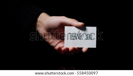 A hand showing a card saying: "Thank You". business concept, thanks, records website.
