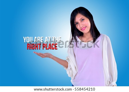  Smiling girl showing open hand palm with text YOU ARE AT THE RIGHT PLACE
