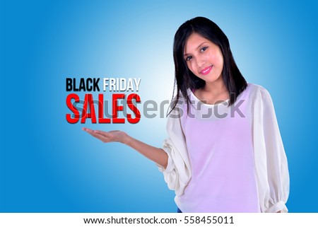  Smiling girl showing open hand palm with text BLACK FRIDAY SALES