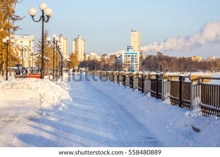 A very beautiful fence.  Walking area. Winter landscape. Open space. Contemporary Russia. Business district, the waterfront.
