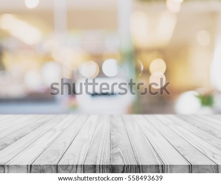 White wood table top with blurred defocus backgrounds