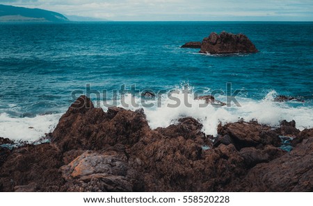 stones in the waves on ocean coast