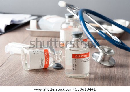 closeup vial of Glucose for Paranteral nutrition and for hypoglycemia. Royalty-Free Stock Photo #558610441