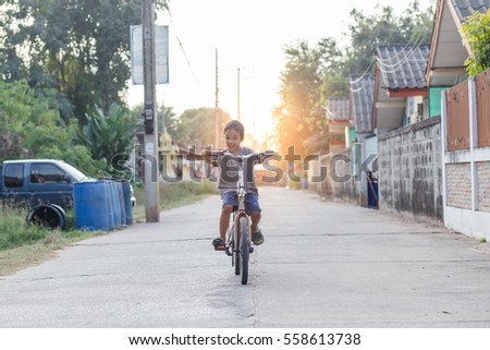 happy children riding on bicycle.