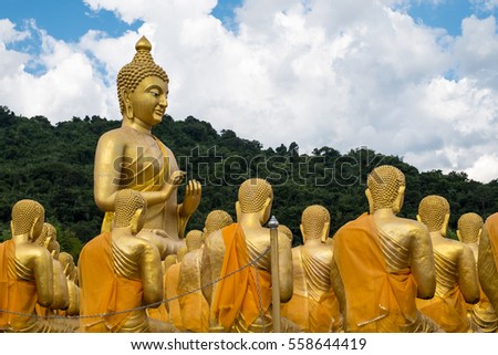 Buddha and disciple in buddhist garden.
