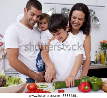 Cute family preparing  lunch together in the kitchen
