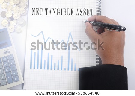 financial report text conceptual with man writing on white notes,stack of coins,graphs and calculator. concept of finance,citation, info, testimonials, notice, textbox. flat