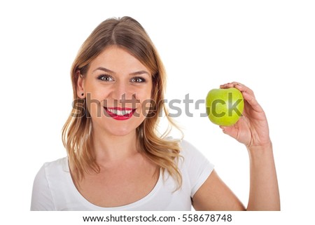 Picture of a smiling young girl with a fresh green apple