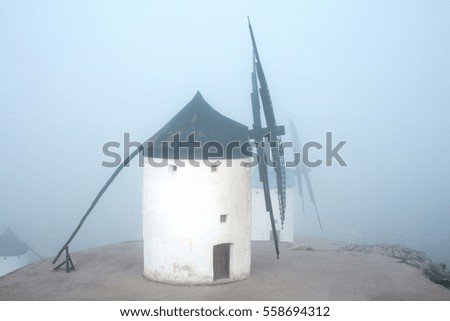 Windmills in a thick fog in Castilla-La Mancha, Spain