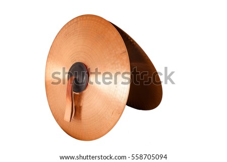 Close up of an prcussion cymbals with leather handle  isolated on background. Royalty-Free Stock Photo #558705094