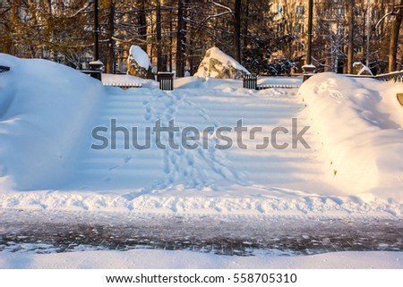 Footprints in the snow. Big city in Russia. Business quarter. Contemporary Russia. Winter. Yekaterinburg. 