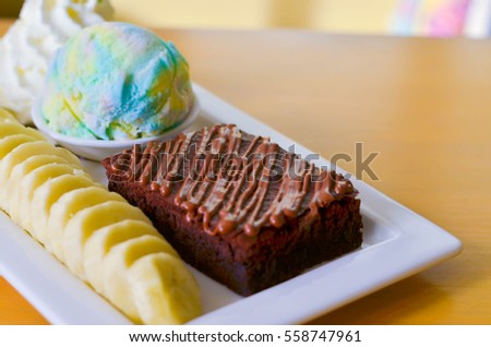 Delicious ice rainbow, brownie, cake, vanilla cream and banana in holiday,select focus