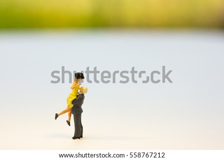 Miniature couple standing using as background valentine day concept