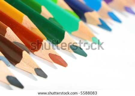 Assortment of colored pencils with shadow on white background -  colored crayons