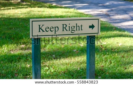 A wooden keep right sign.