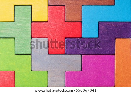 Abstract Background. Background with different colorful shapes wooden blocks . Geometric shapes in different colors. Concept of creative, logical thinking or problem solving.  Royalty-Free Stock Photo #558867841