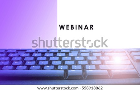a close up on a computer keyboard with flare and text WEBINAR