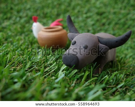 animals toy in green grass 