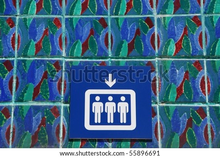 blue and white elevator sign on portuguese azulejos/tiles