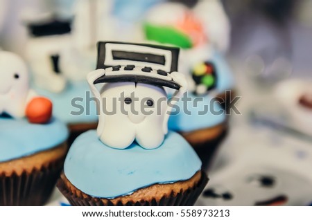 Beautiful cake with programmer tooth hero on top for children first tooth party 