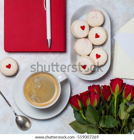 Top view of white macarons with red heart. Saint Valentines Day composition. Square photo.