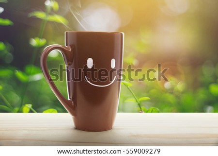 Brown mug of coffee with a happy smile, Good day, Good morning or Have a happy day concept