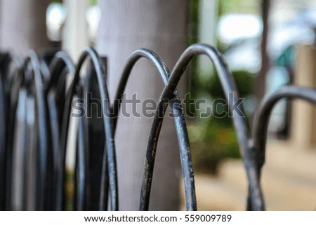 Silver aluminum fence outside a building