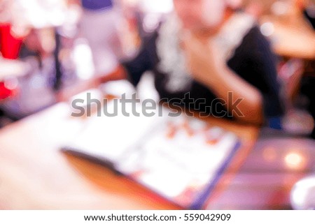 Picture blurred  for background abstract and can be illustration to article of lady in restaurant