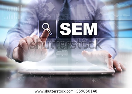 Businessman using tablet pc and selecting sem.