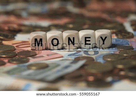 money - cube with letters, money sector terms - sign with wooden cubes