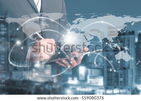 double exposure of businessmen using tablet with blur city night and network connection concept