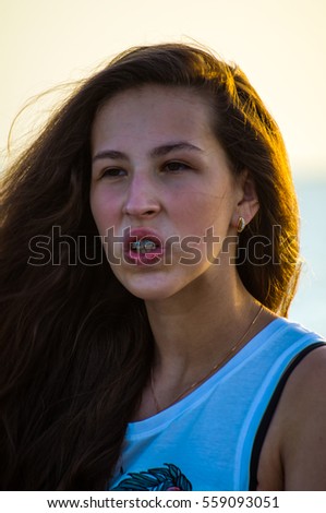 girl smiling at sunset