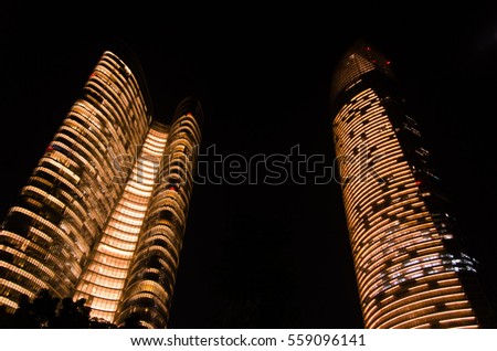 Charming golden building lights during the night, Abu-Dhabi, United Arab Emirates Royalty-Free Stock Photo #559096141