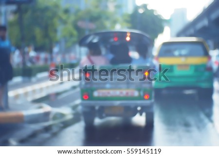 Picture blurred  for background abstract and can be illustration to article of threewheeler classic motorised tuk-tuk taxi in Bangkok, Thailand