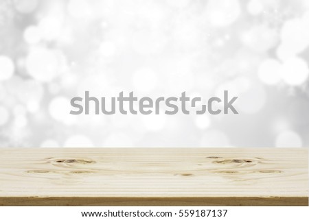 Wood table top on shiny bokeh white background, used for display your products