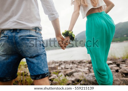 lovely couple holding hands together. Close up shot