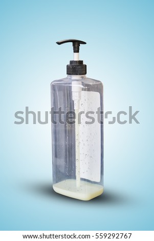 bottle of shampoo with water drop isolate on blue background