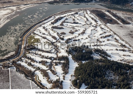 Aerial view of a snow covered Golf Course. Picture taken during a cold and sunny winter day. Swaneset Bay Resort & Country Club.