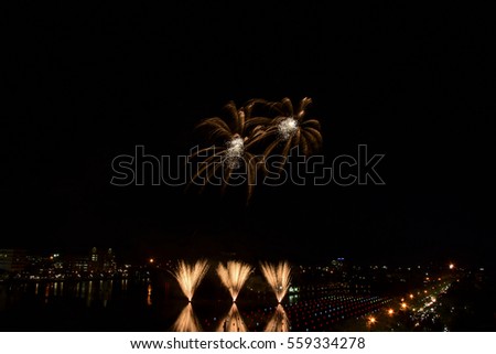 Bridge in Nhong Prajak Public Park Bridge with fireworks. Udonthani, Thailand.